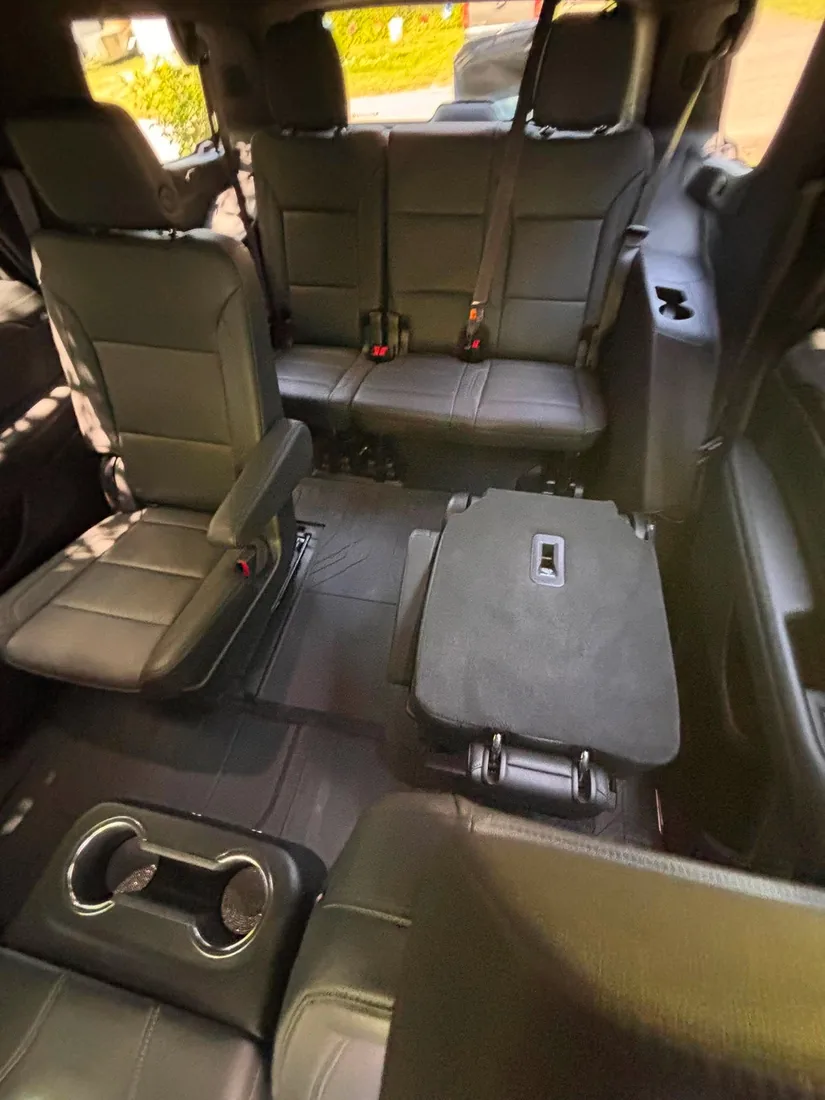 Third row after detailing — spotless carpet and leather