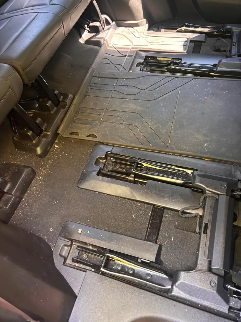 Third row floor before detailing — covered in dirt and debris